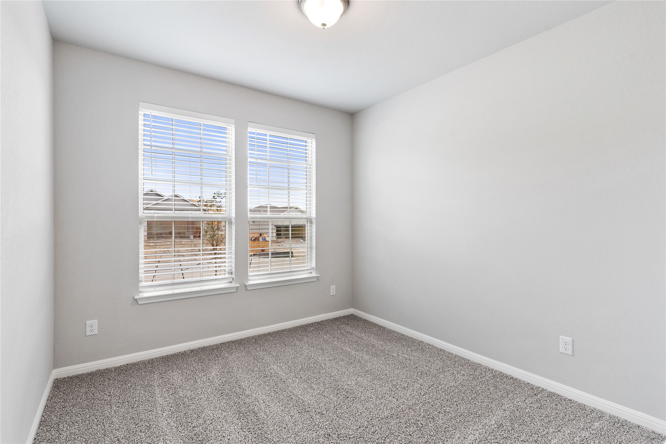313 Mclintock Road Jarrell, TX 76537 - Photo 4 of 17 Well-lit room with ample natural illumination, perfect for a versatile space.