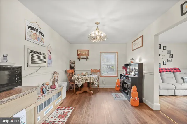 a bedroom with furniture and a chandelier