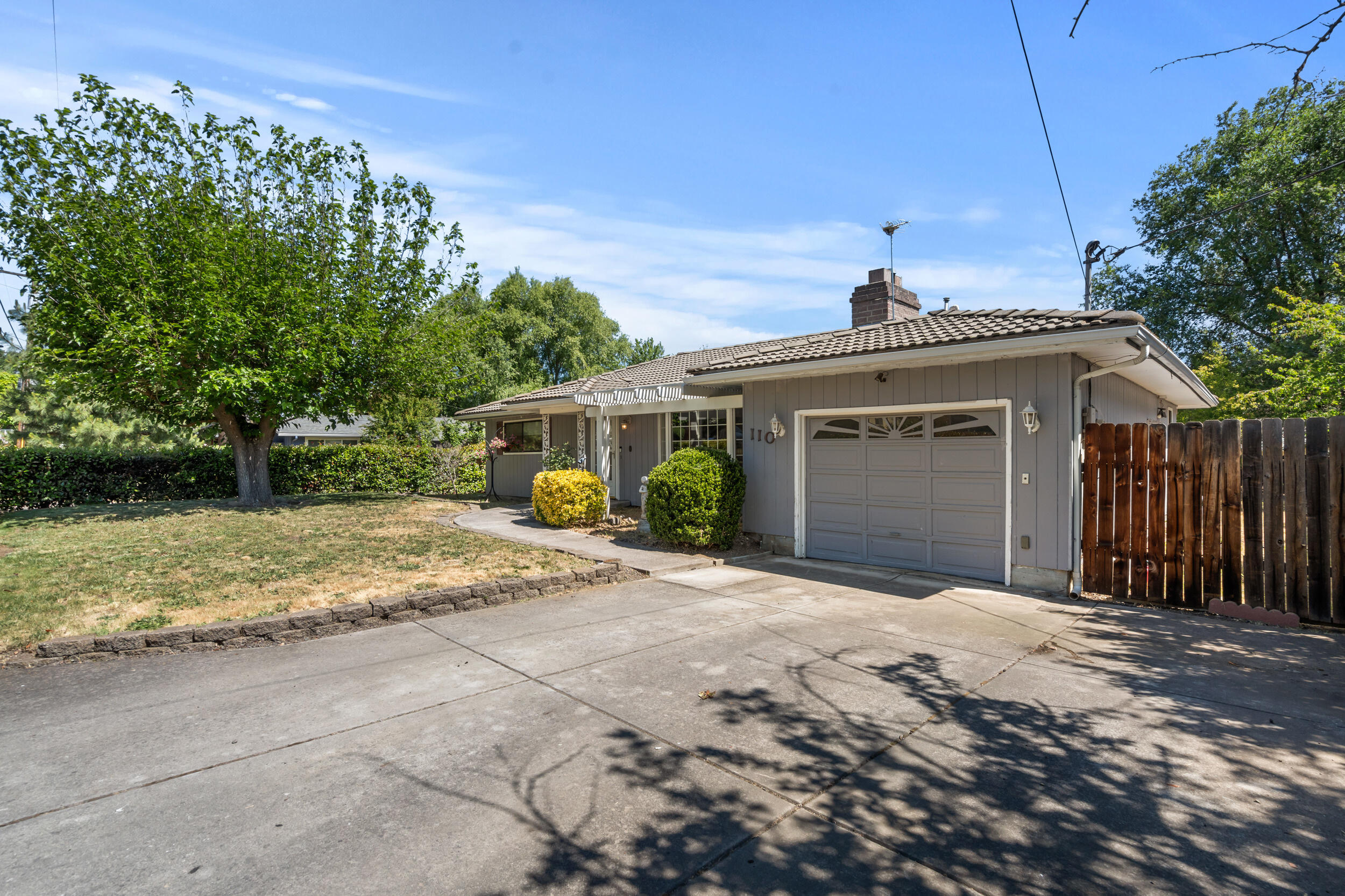 110 North 2nd Street Talent, OR 97540 - Photo 2 of 27 a view of a house with a patio and a yard