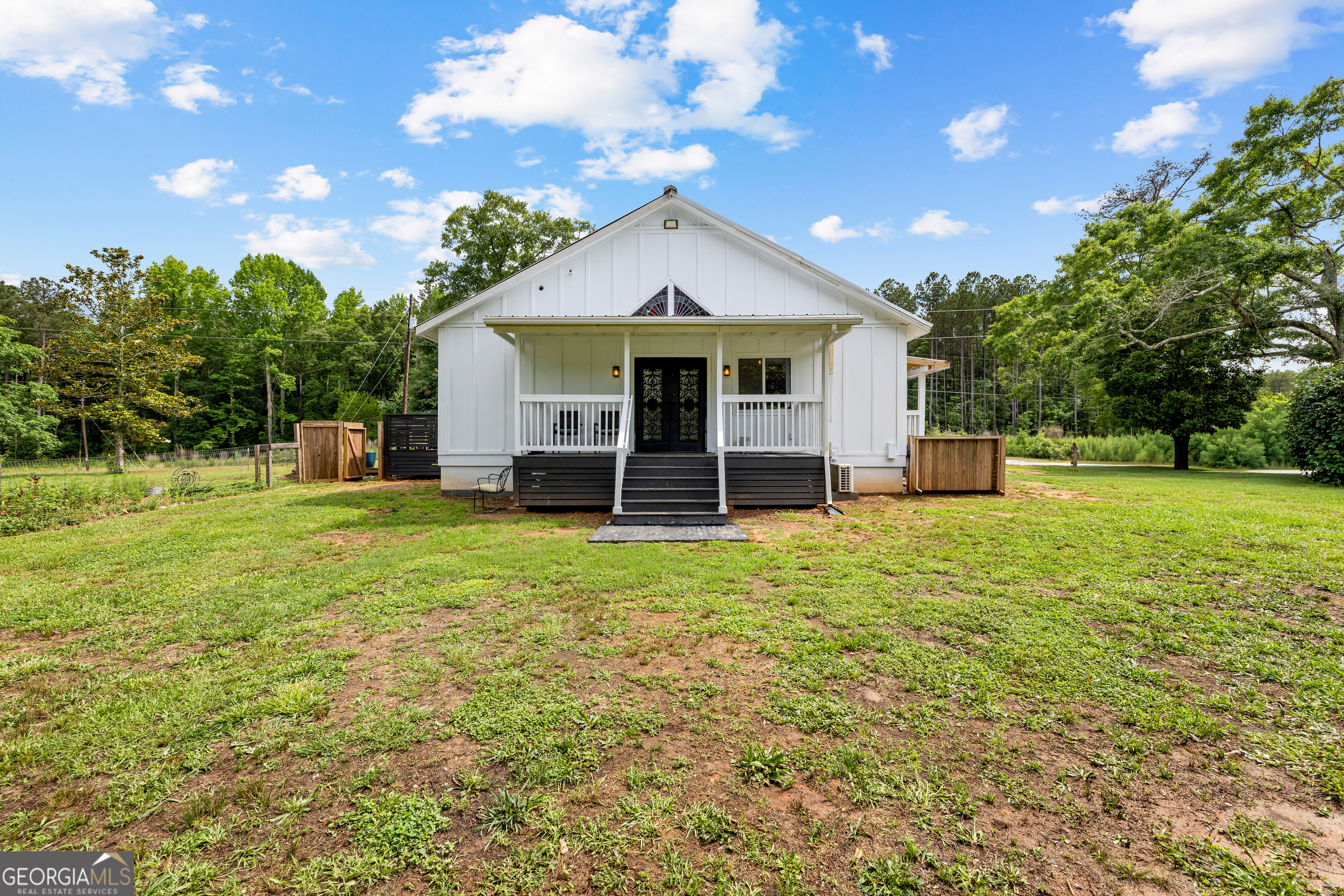 1329 Standing Rock Road Senoia, GA 30276 - Photo 71 of 77 a front view of a house with garden