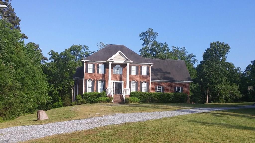 4910 Cade Road Climax, NC 27233 - Photo 1 of 13 Home is 3 sided brick with gravel driveway