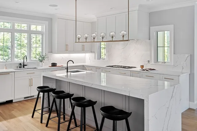 a kitchen with a sink cabinets and window
