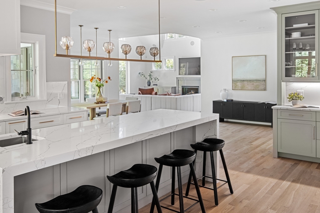 78 Pheasant Landing Road Needham, MA 02492 - Photo 13 of 35 a kitchen with kitchen island stainless steel appliances a sink and cabinets