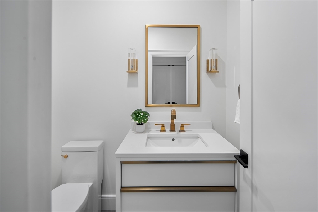 78 Pheasant Landing Road Needham, MA 02492 - Photo 15 of 35 a bathroom with a sink toilet and mirror