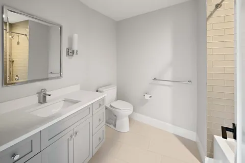 a dining room with furniture a fireplace and a chandelier