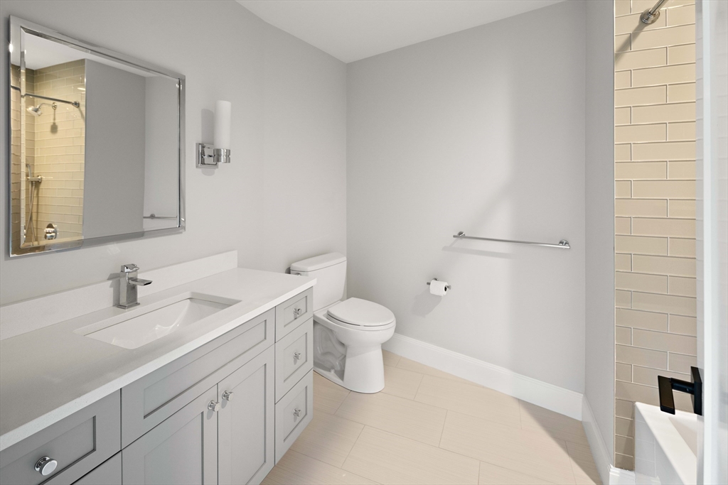 78 Pheasant Landing Road Needham, MA 02492 - Photo 28 of 35 a bathroom with a sink a toilet and a mirror