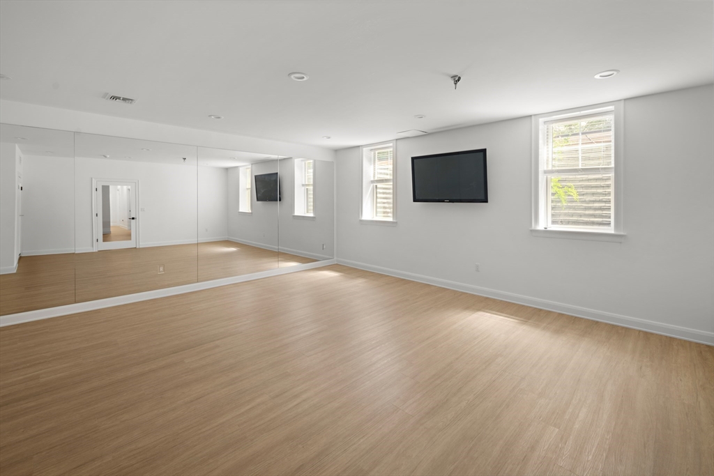 78 Pheasant Landing Road Needham, MA 02492 - Photo 30 of 35 a view of an empty room with wooden floor and a window
