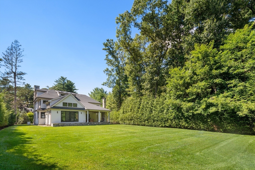 78 Pheasant Landing Road Needham, MA 02492 - Photo 32 of 35 a front view of a house with a garden