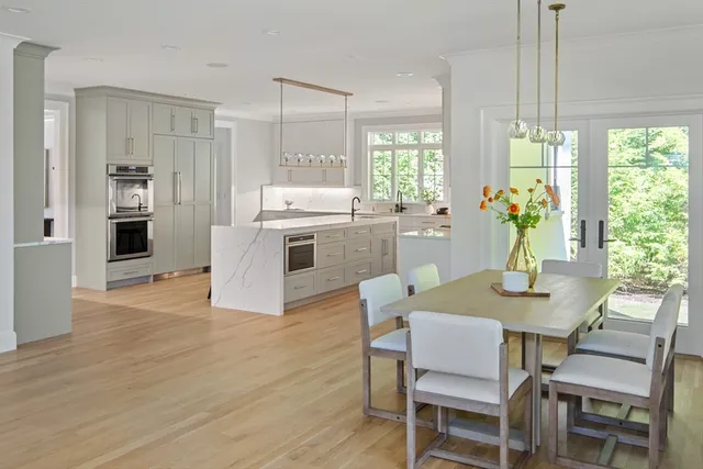 a kitchen with a table and chairs in it