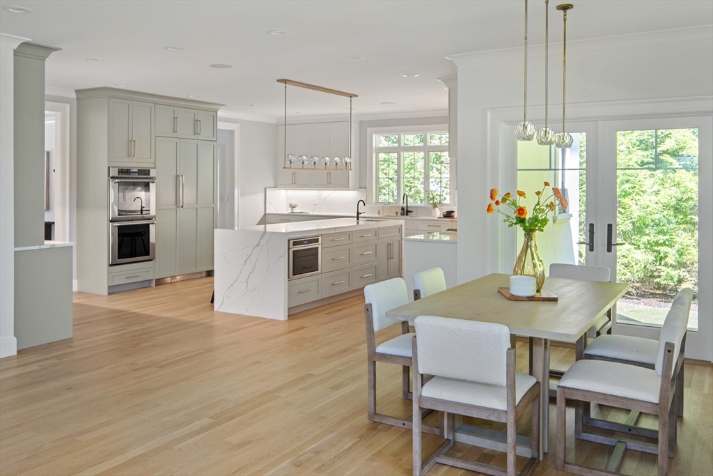 78 Pheasant Landing Road Needham, MA 02492 - Photo 9 of 35 a kitchen with a table and chairs in it