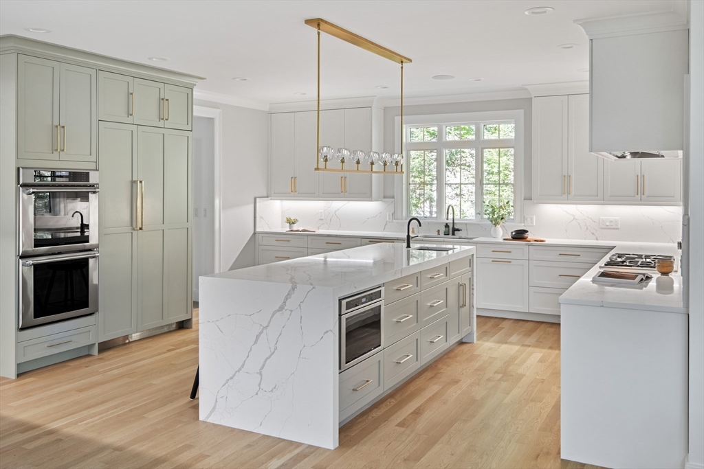 78 Pheasant Landing Road Needham, MA 02492 - Photo 10 of 35 a kitchen with white cabinets and white appliances