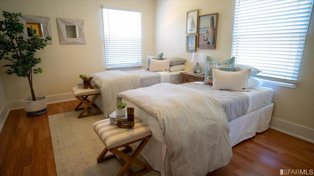 2823 Park Street Berkeley, CA 94702 - Photo 12 of 16 a bedroom with a bed and a potted plant