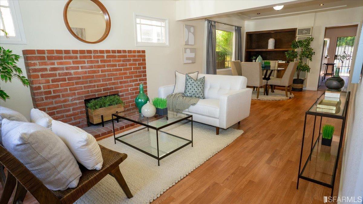 2823 Park Street Berkeley, CA 94702 - Photo 5 of 16 a living room with furniture a fireplace and wooden floor