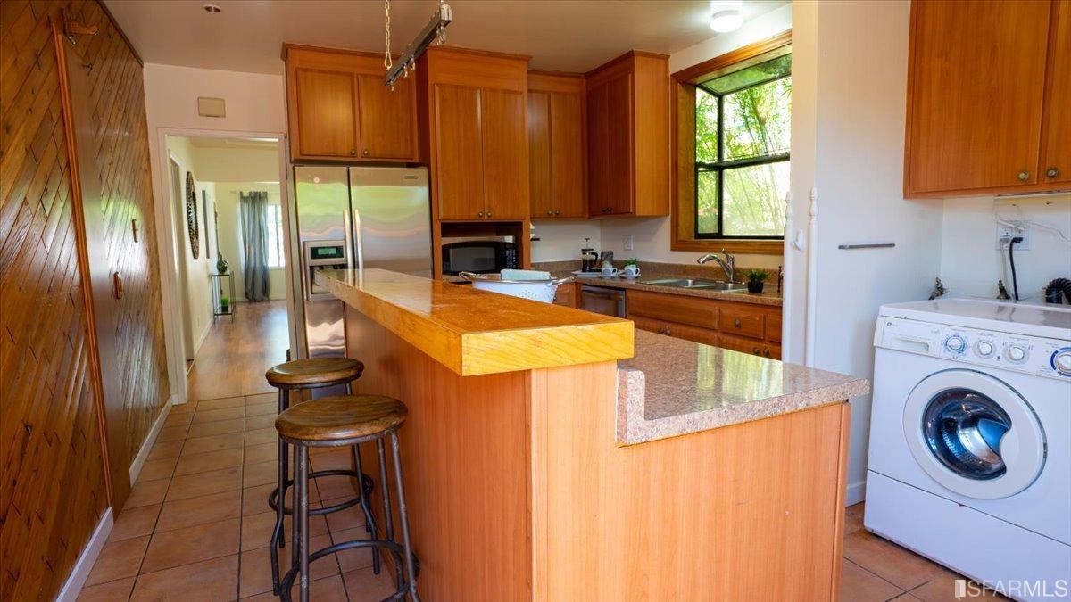 2823 Park Street Berkeley, CA 94702 - Photo 8 of 16 a kitchen that has a sink and a stove in it