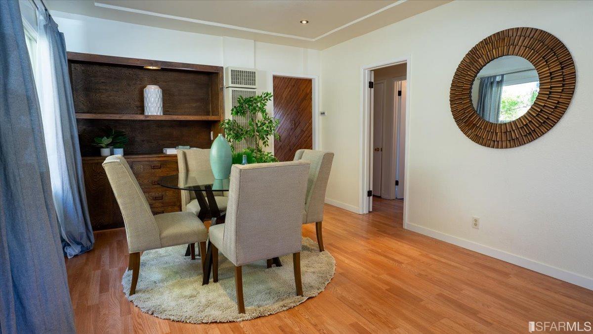 2823 Park Street Berkeley, CA 94702 - Photo 9 of 16 a view of a dining room with furniture and a mirror