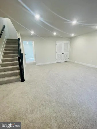 a view of an empty room with stairs