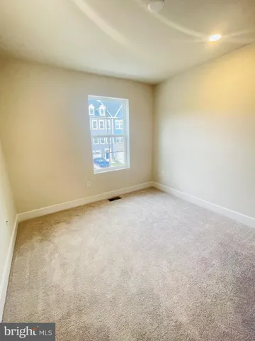 an empty room with a windows