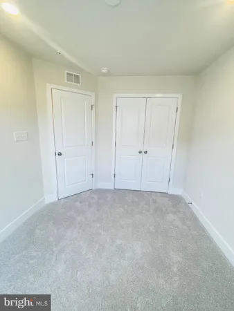 a view of an empty room and entryway