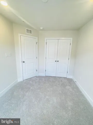 a view of an empty room and entryway