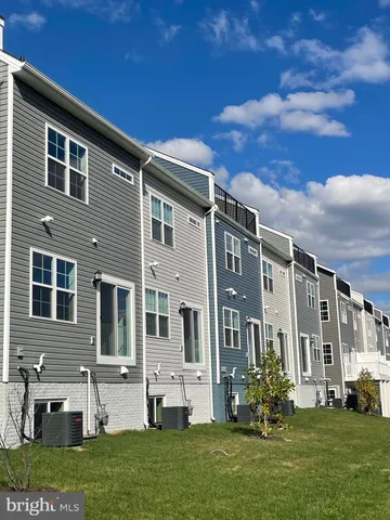a front view of building with yard