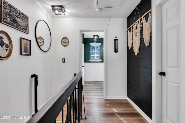 a bathroom with a large mirror and a shower