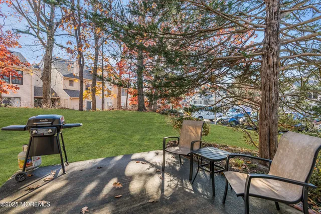 a view of a chairs and table in the garden