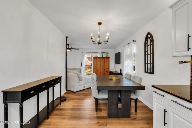 a view of kitchen island with furniture and wooden floor