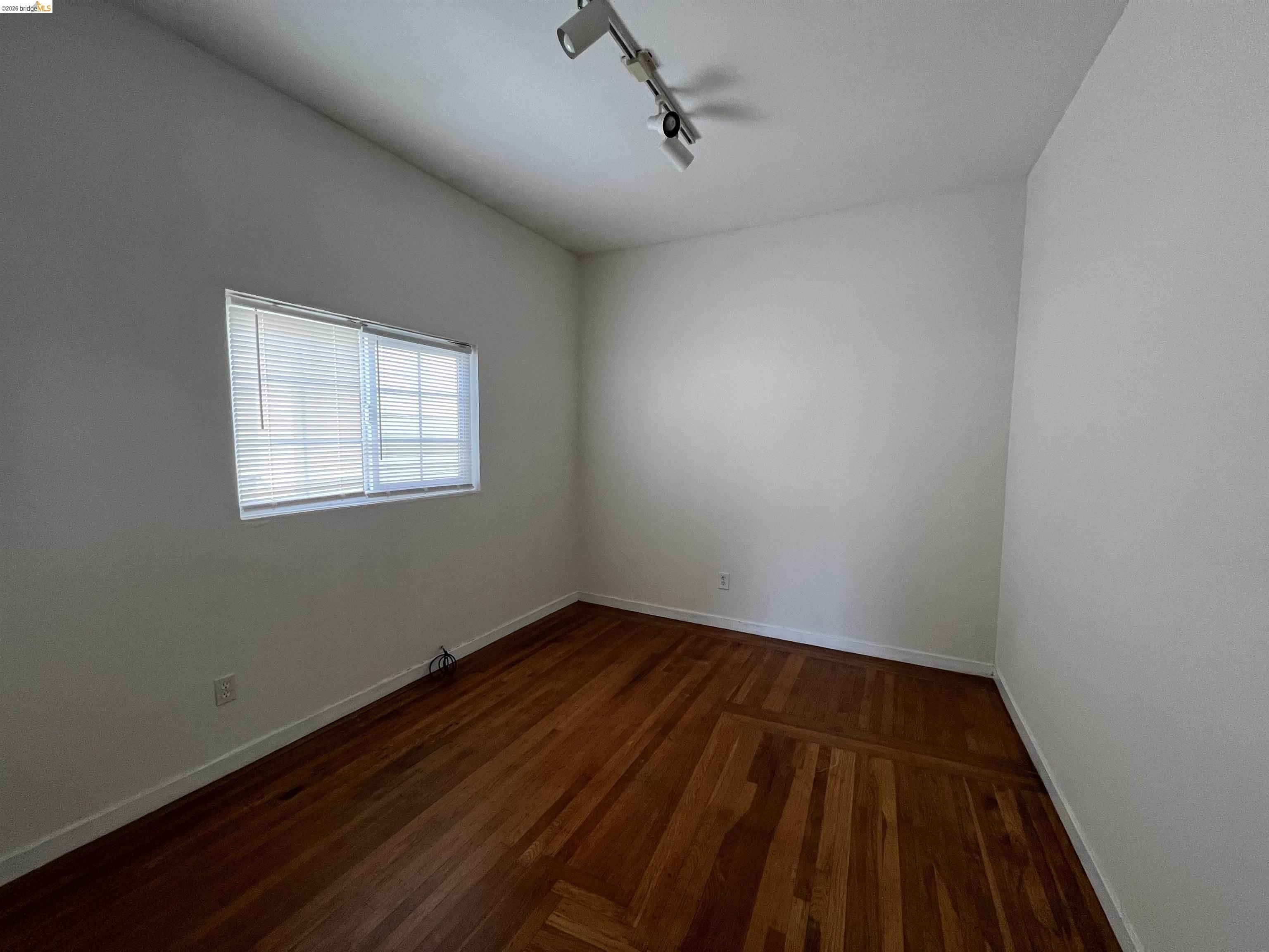3244 Ellis Street, Unit B Berkeley, CA 94703 - Photo 2 of 4 a view of a room with wooden floor and windows