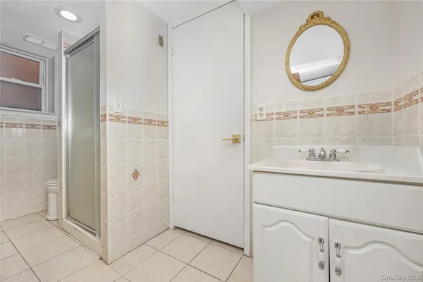 a bathroom with a sink a mirror and a bathtub