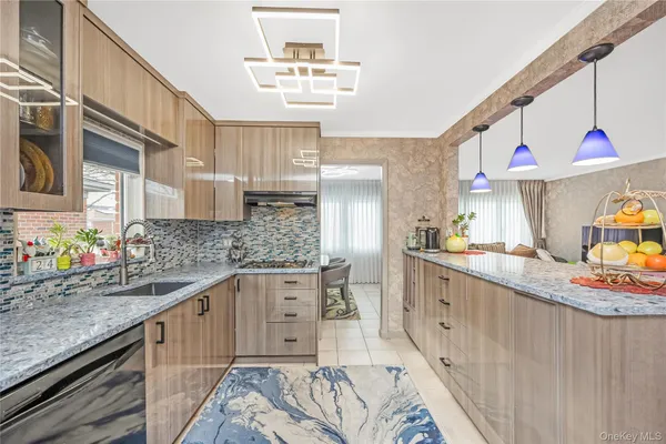 a kitchen with stainless steel appliances granite countertop a sink and cabinets