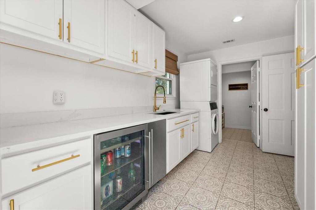 6305 Genoa Road Fort Worth, TX 76116 - Photo 12 of 33 a kitchen with a sink and cabinets