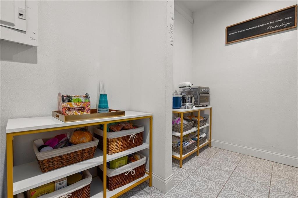 6305 Genoa Road Fort Worth, TX 76116 - Photo 13 of 33 a room that has a dresser and a book shelf