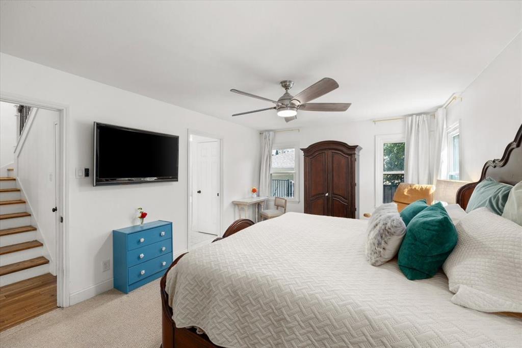6305 Genoa Road Fort Worth, TX 76116 - Photo 15 of 33 a bedroom with a bed and a flat screen tv on the dresser