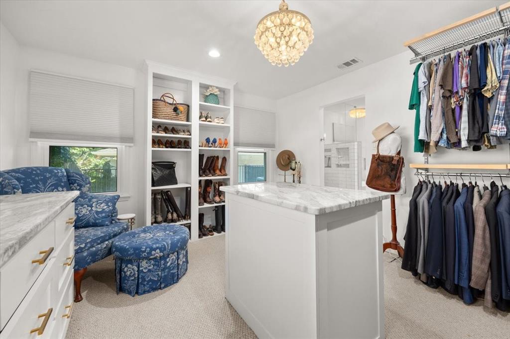 6305 Genoa Road Fort Worth, TX 76116 - Photo 19 of 33 a living room with furniture and a bookshelf