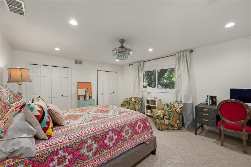 6305 Genoa Road Fort Worth, TX 76116 - Photo 20 of 33 a bedroom with a bed a couch and dresser