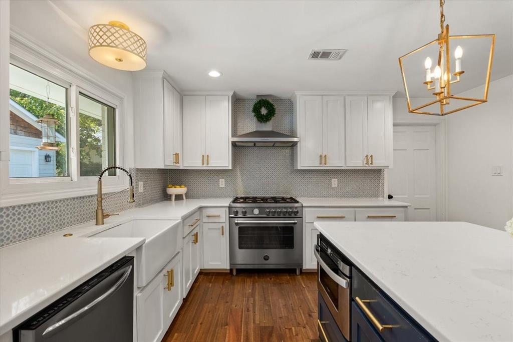 6305 Genoa Road Fort Worth, TX 76116 - Photo 2 of 33 a kitchen with a stove a sink and a window