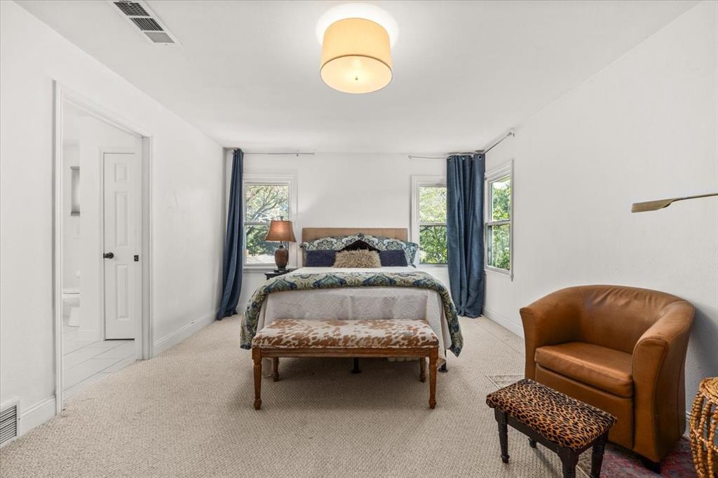 6305 Genoa Road Fort Worth, TX 76116 - Photo 23 of 33 a bed room with a bed and a chair