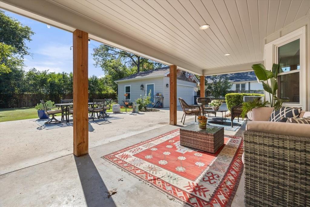 6305 Genoa Road Fort Worth, TX 76116 - Photo 26 of 33 a building outdoor space with patio furniture and potted plants