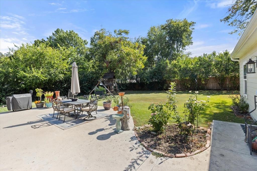 6305 Genoa Road Fort Worth, TX 76116 - Photo 29 of 33 a view of a swimming pool with a patio