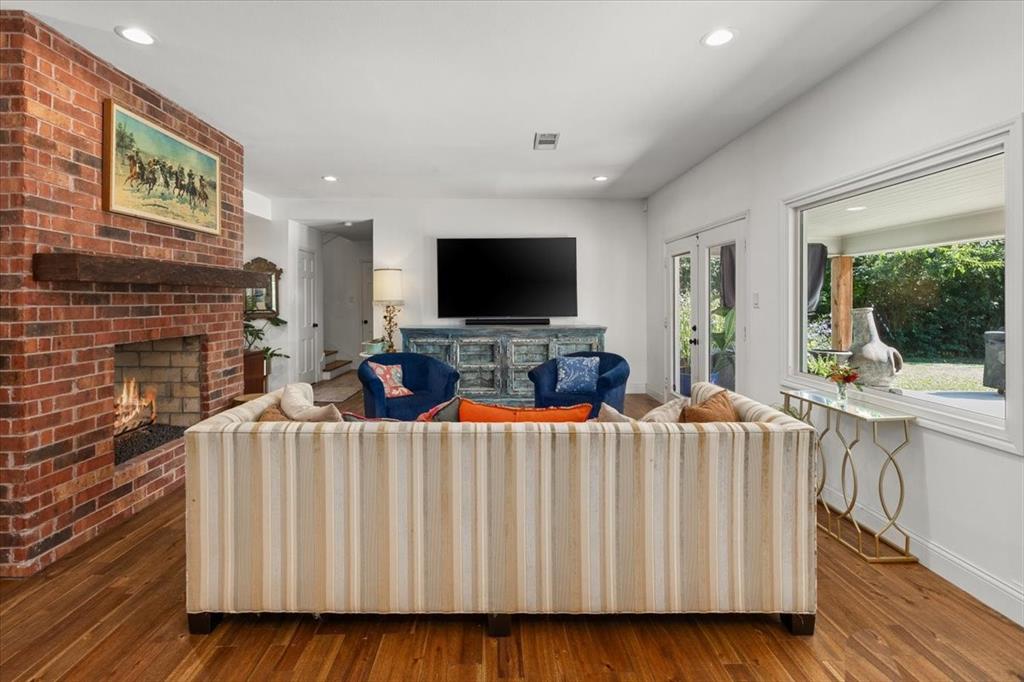 6305 Genoa Road Fort Worth, TX 76116 - Photo 6 of 33 a living room with furniture and a flat screen tv