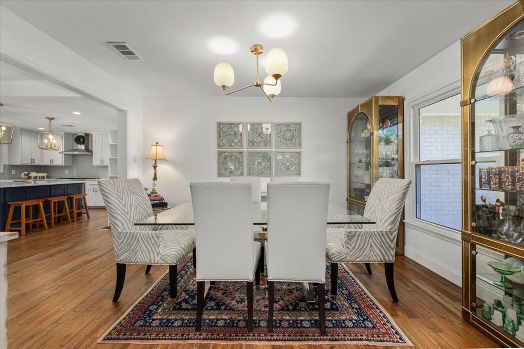 6305 Genoa Road Fort Worth, TX 76116 - Photo 7 of 33 a view of a dining room with furniture window and wooden floor