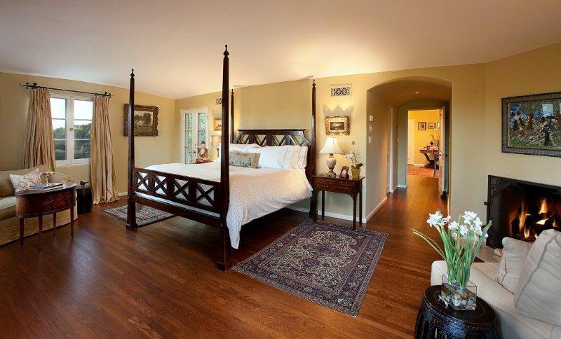 810 Lilac Drive Montecito, CA 93108 - Photo 7 of 14 a spacious bedroom with a bed table and a couch