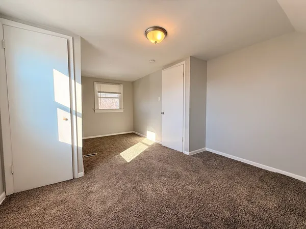 a view of an empty room and window