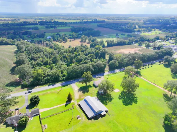 an aerial view of a house with a garden
