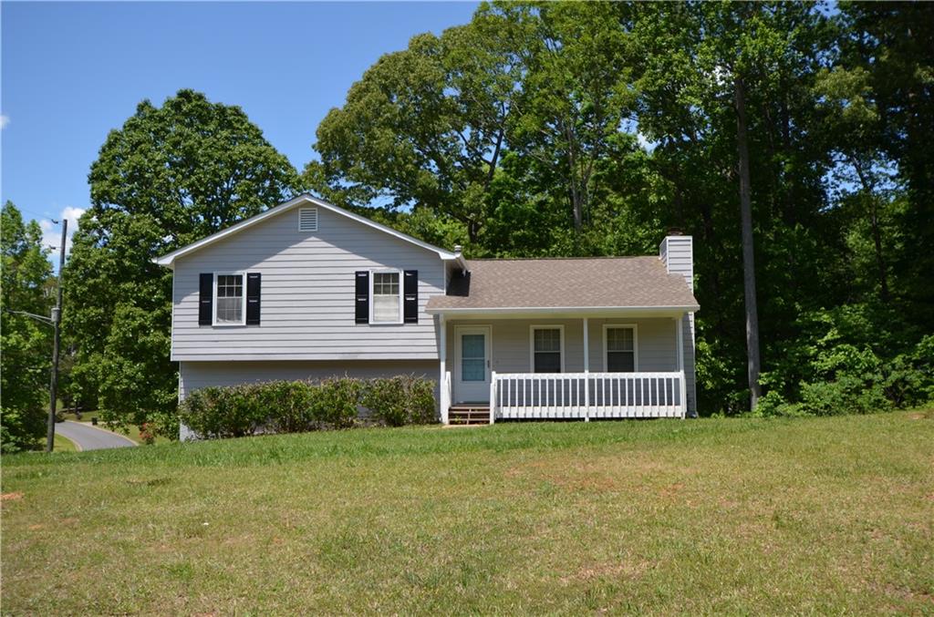 a front view of a house with yard