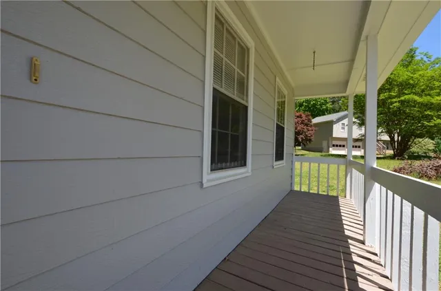 a view of balcony with wooden floor