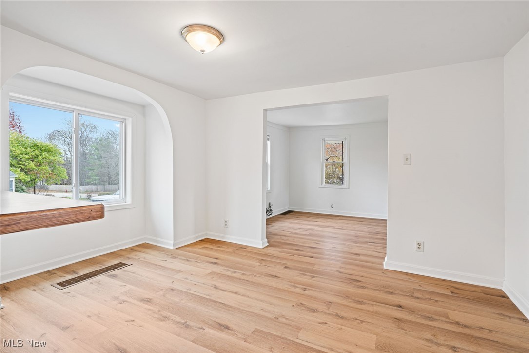 3426 Marsh Road Stow, OH 44224 - Photo 10 of 37 Spare room with light wood-style floors and arched walkways