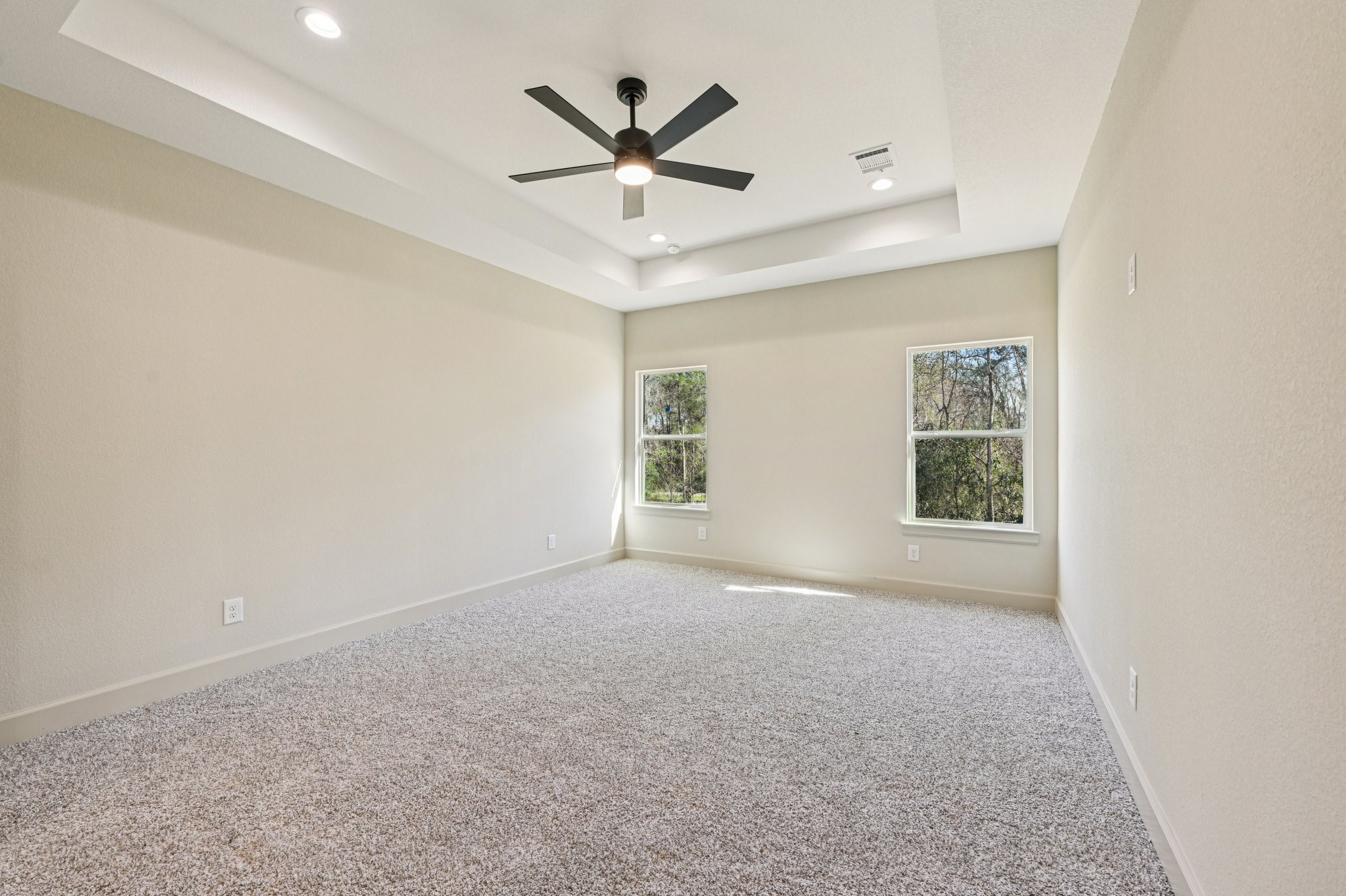 15132 Coaltown Road Willis, TX 77378 - Photo 22 of 29 Beautiful Primary Bedroom offering generous space and a vaulted ceiling for an elevated design.