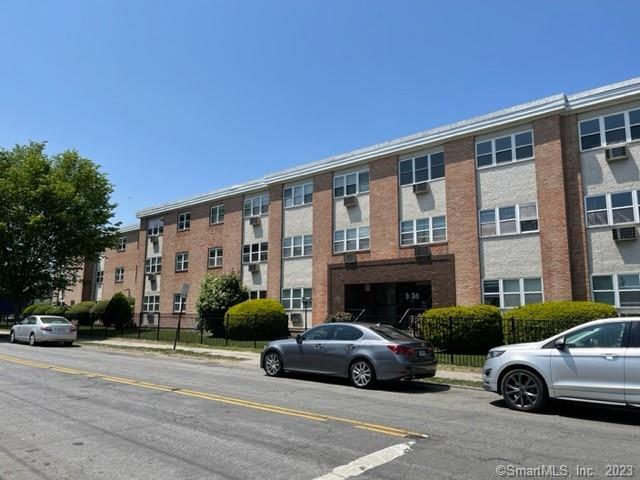 a view of a car parked in front of a building