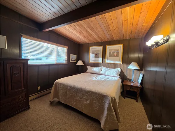 a bedroom with a bed and a bathroom